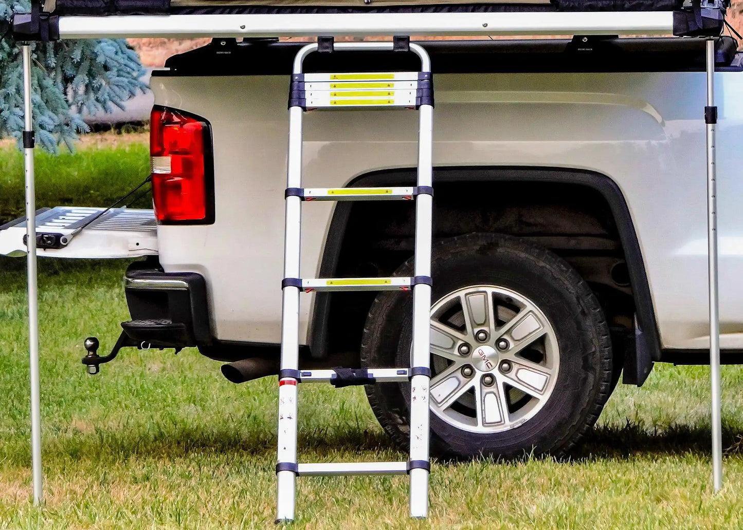 Rooftop tent stabilizer and awning pole installed
